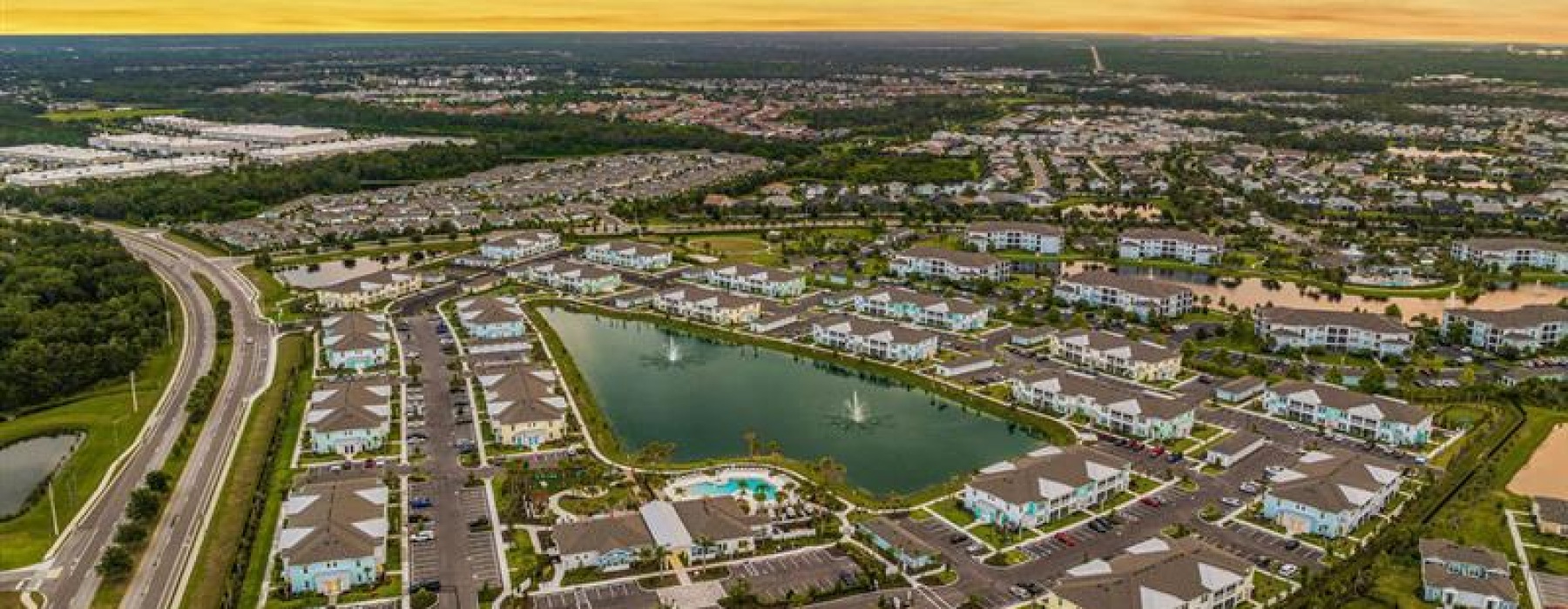 Bird's eye view of the Vida Lakewood Ranch community pool next to the lake