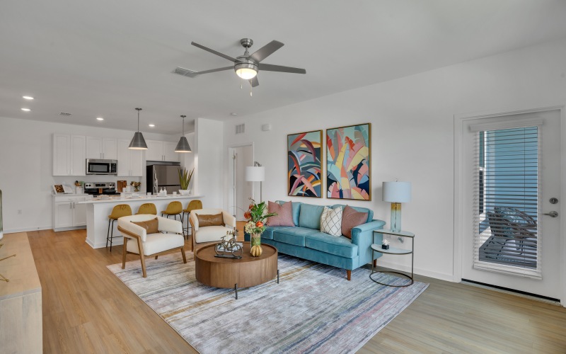 Furnished apartment home with living room ceiling fans in units at Vida Lakewood Ranch