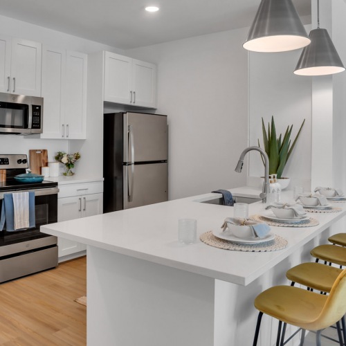 Well-lit kitchen with ample counter space in apartments at Vida Lakewood Ranch